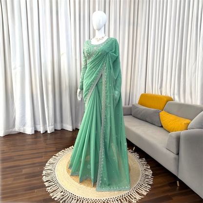 Sequined and pearl work saree and blouse set.