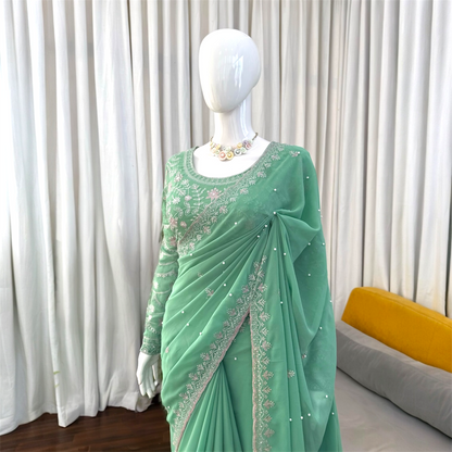 Sequined and pearl work saree and blouse set.