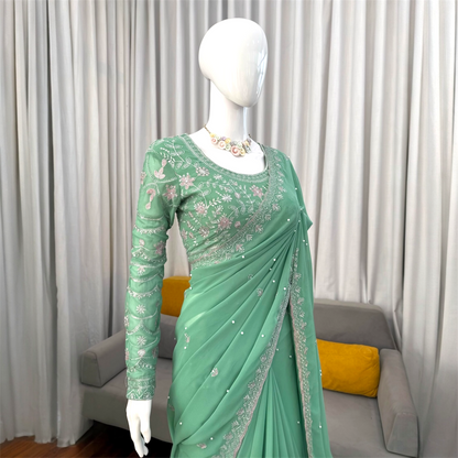 Sequined and pearl work saree and blouse set.