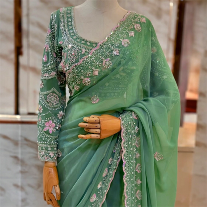 Sequined and pearl work saree and blouse set.