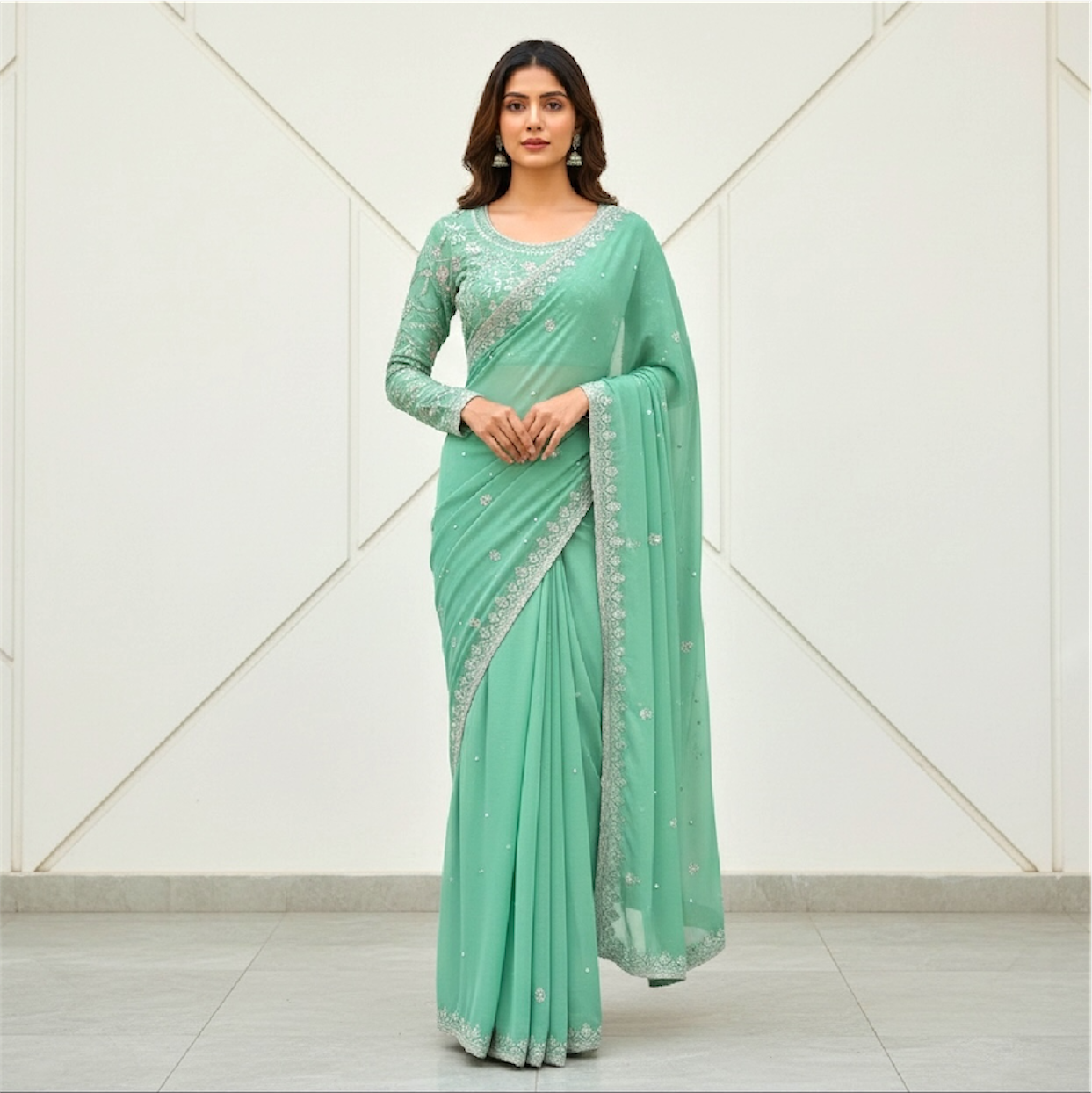 Sequined and pearl work saree and blouse set.